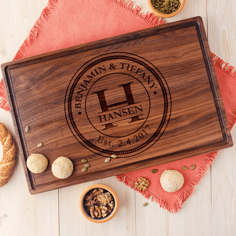 Personalized walnut cutting board as personalized wooden wedding gifts.