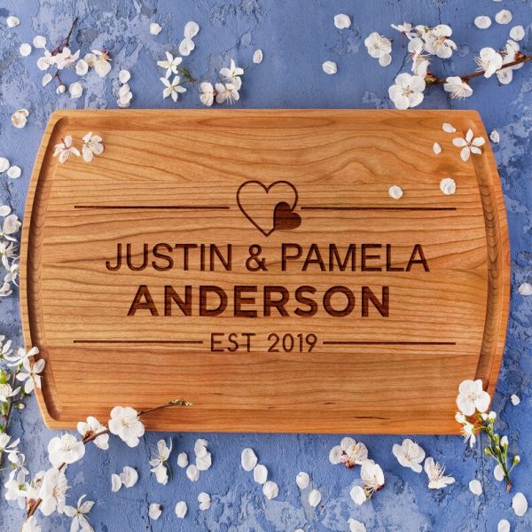 Wood Anniversary Cheese Board with the words Justin and Pamela Anderson on it.