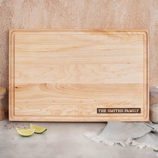 Personalized Wood Cutting Board with the family name on it.