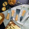 A cheese board with cheese and crackers on it.