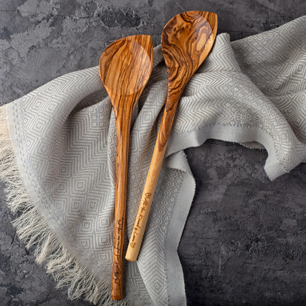 Wood Spoons (Corner) on top of a blanket.