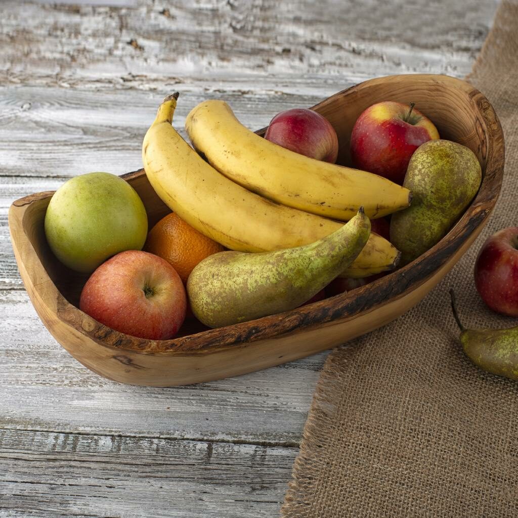A Large Olive Wood Fruit Bowl - Oval filled with fruit.
