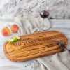 A bbq charcuterie board with a glass of wine on it.