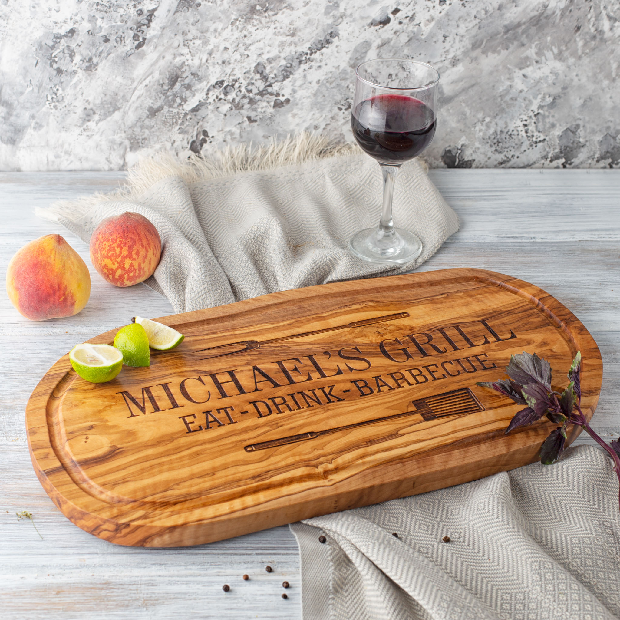 A bbq charcuterie board with a glass of wine on it.