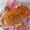 A Personalized BBQ Cutting Board with the name Roberts on it.