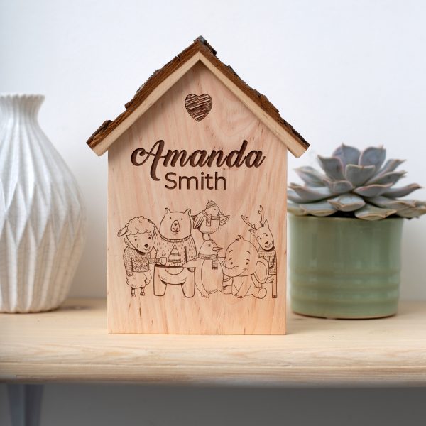 A wooden house with the name amanda smith on it.