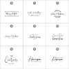 Nine assorted black and white table number cards with various fonts and decorative text, including names and dates.