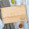 A wooden cutting board with the words the williams family on it.