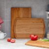 three wooden cutting board on a kitchen counter.