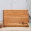 A wooden cutting board with the name williams on it.