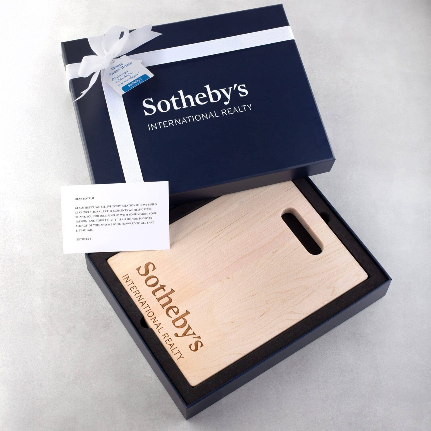 Blue corporate gift box with a wooden engraved cutting board