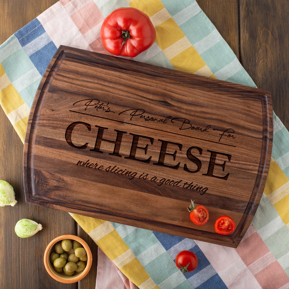 A Charcuterie Board with cheese and vegetables on it.