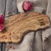 A custom wooden cutting board with logo