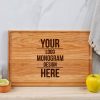 A wooden cherry cutting board with your logo and monogram design.
