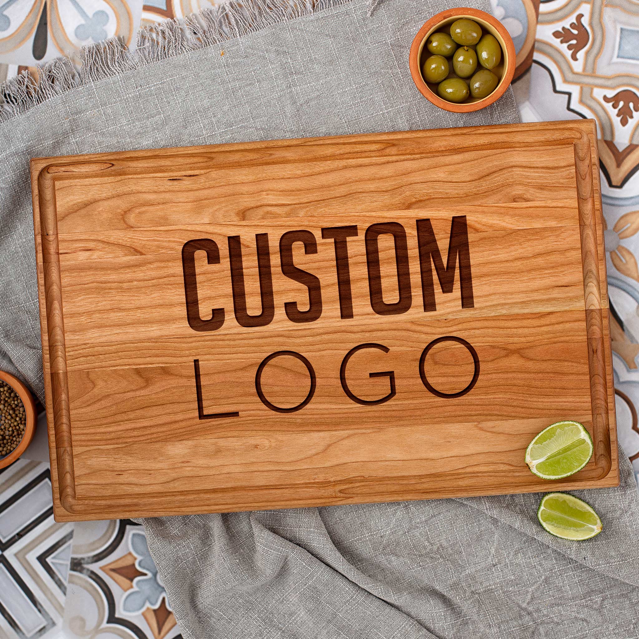 A wooden cherry cutting board with the word custom logo on it.